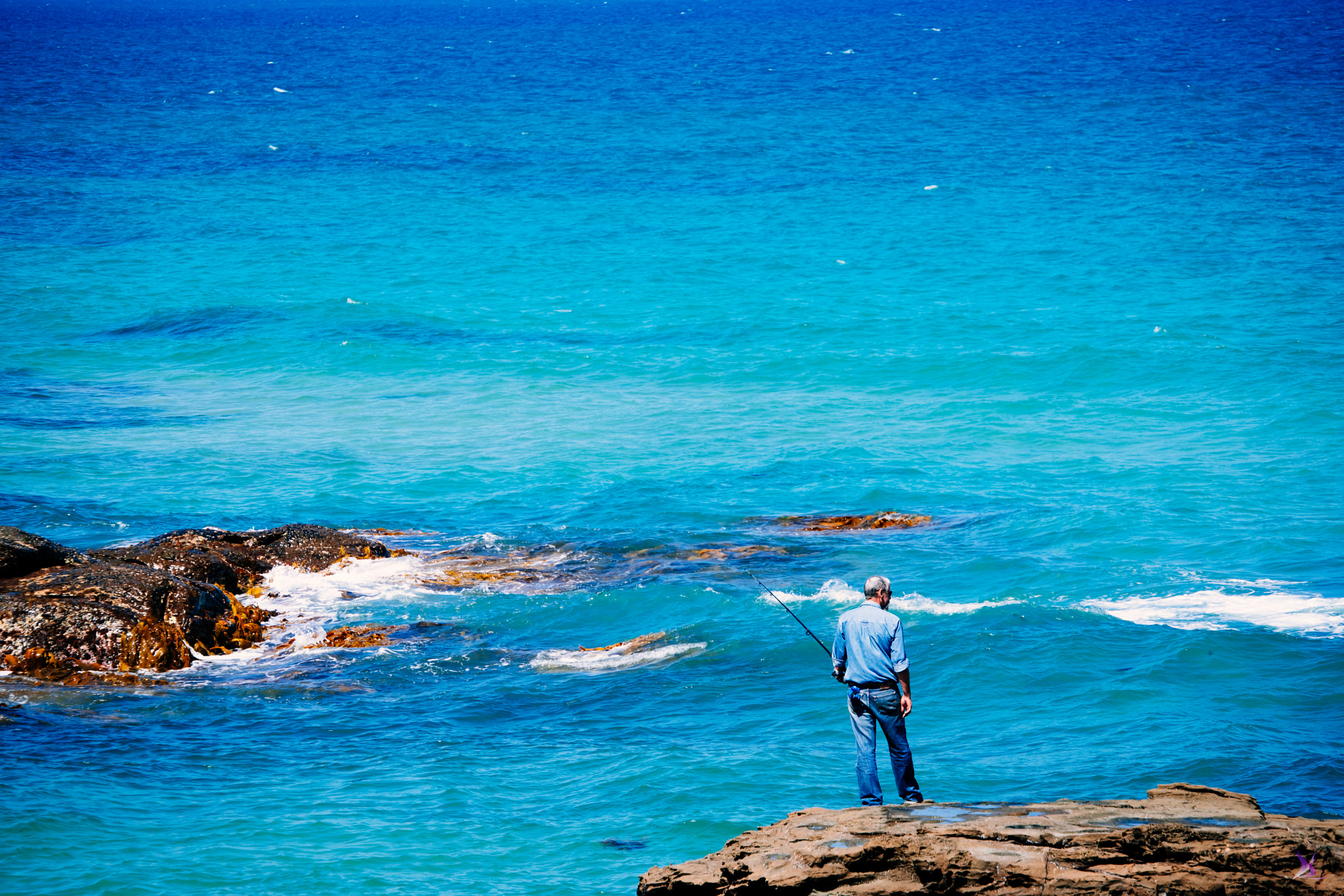 Sony a7R II + Canon EF 70-300mm F4.5-5.6 DO IS USM sample photo. Great ocean road and fishing man photography
