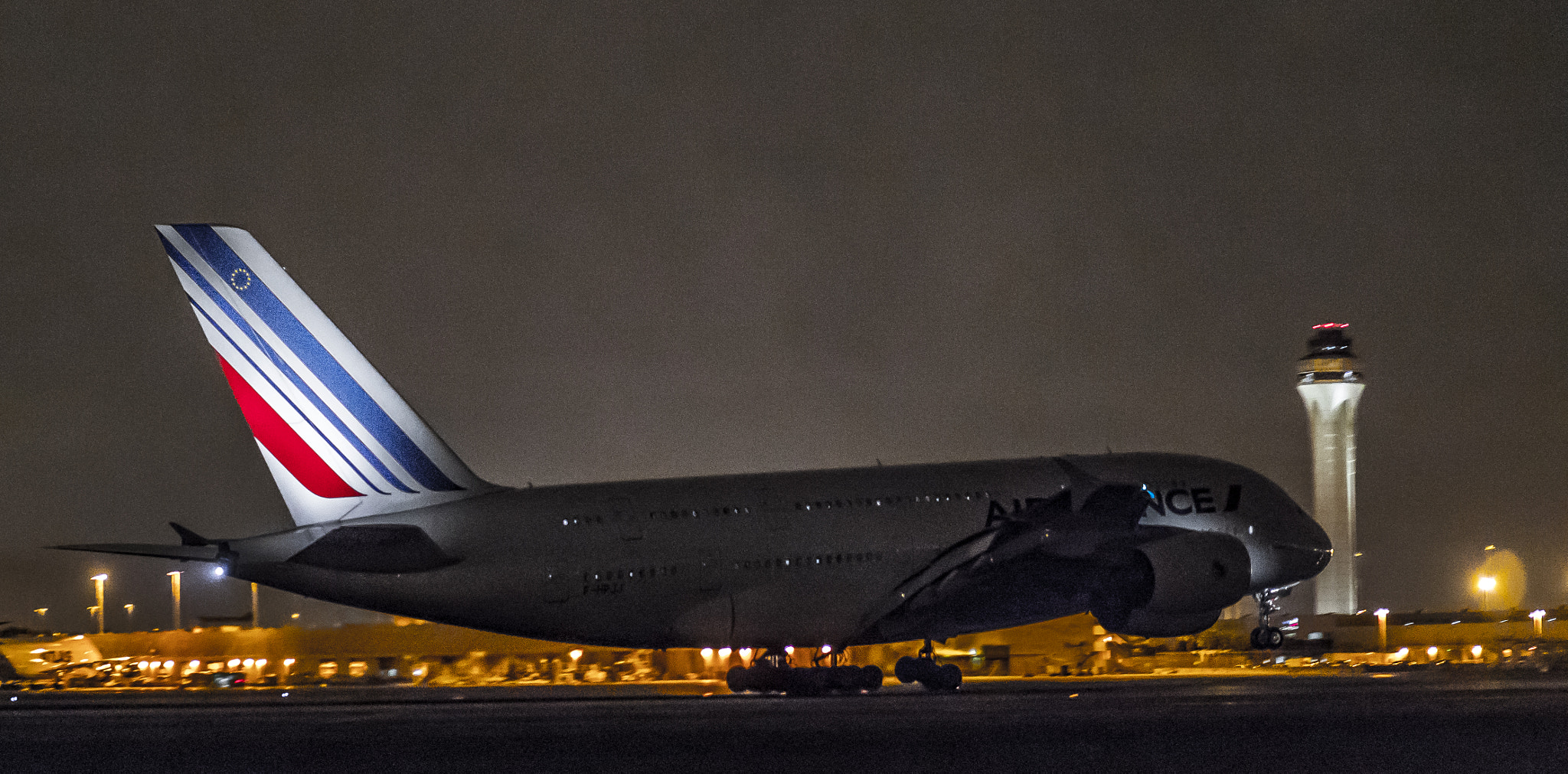 Panasonic Leica DG Nocticron 42.5mm F1.2 ASPH OIS sample photo. Late night arrival a380 photography
