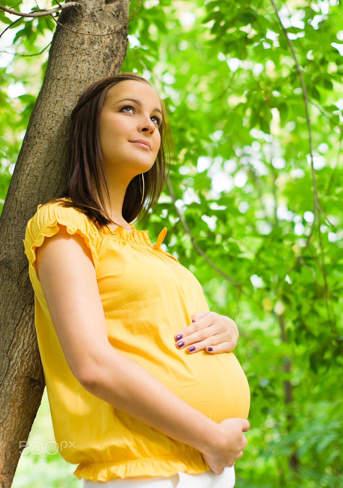 Sony Alpha DSLR-A550 + Sony 50mm F1.4 sample photo. Beautiful pregnant woman in the park photography