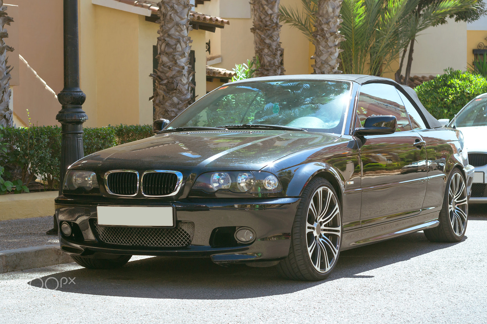 Nikon D3100 + Sigma 50mm F1.4 EX DG HSM sample photo. Black modern coupe-car bmw 3 series on sunny street, torrevieja, photography