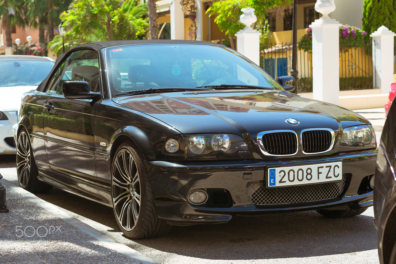 Nikon D3100 + Sigma 50mm F1.4 EX DG HSM sample photo. Black modern coupe-car bmw 3 series on sunny street, torrevieja, photography