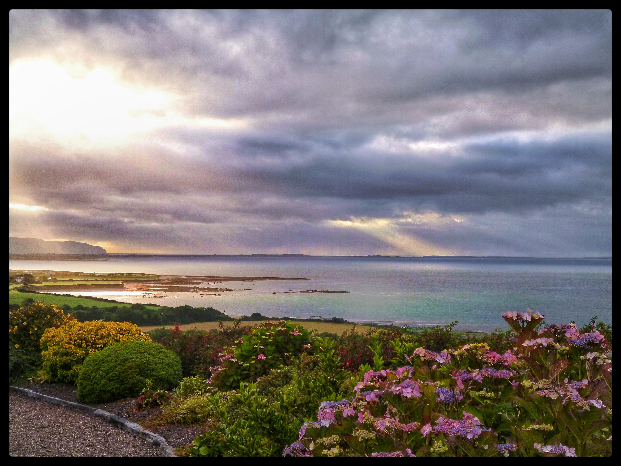 Panasonic DMC-FS16 sample photo. Sunny, cloudy irish coast photography