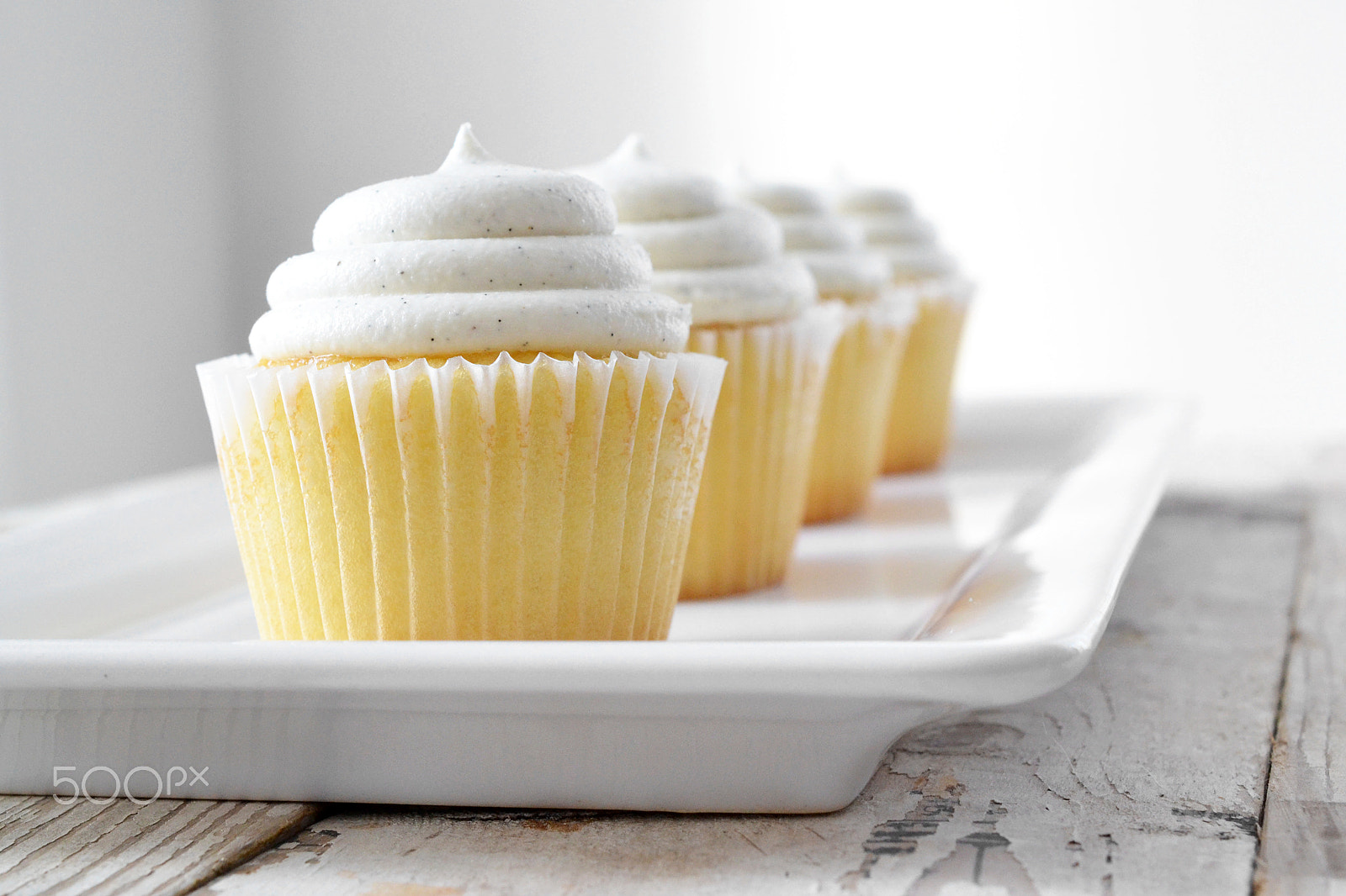 Nikon D3100 + Nikon AF Nikkor 50mm F1.4D sample photo. Vanilla cupcakes on white ceramic tray photography