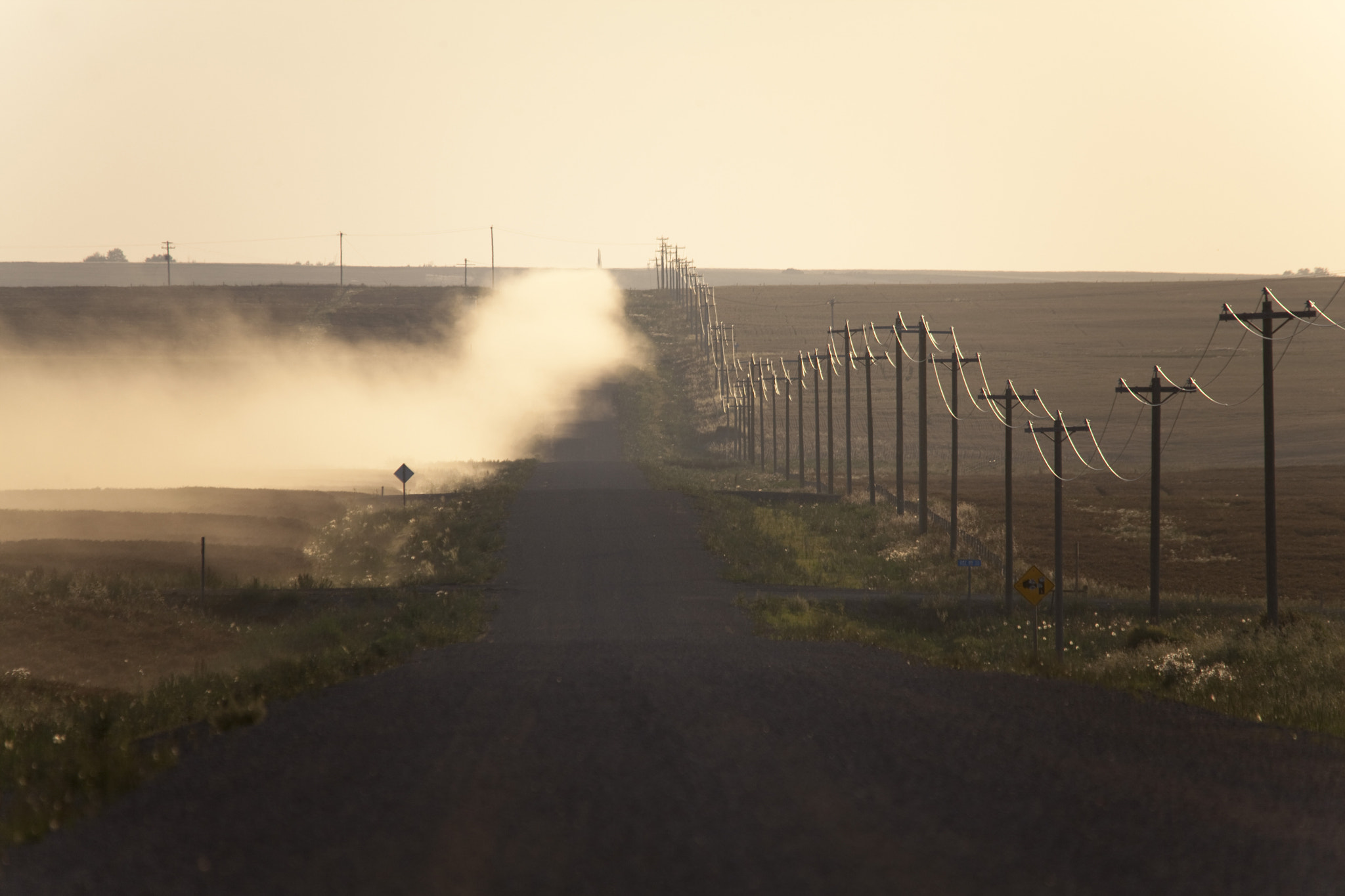 Sigma 150-500mm F5-6.3 DG OS HSM sample photo. A dusty road and telephone lines photography