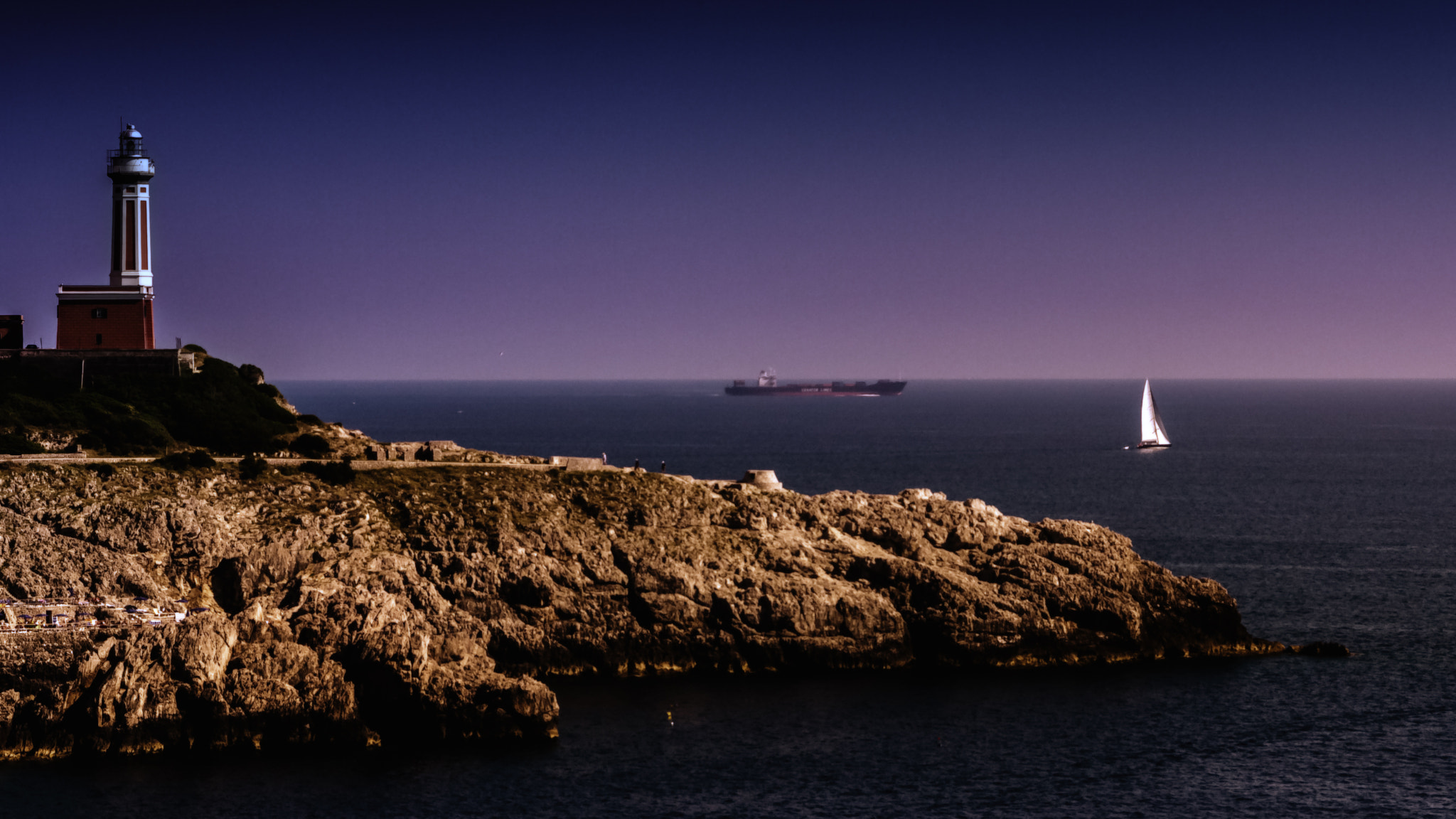 Canon EOS 40D + Sigma 24-70mm F2.8 EX DG Macro sample photo. The lighthouse and the sail boat photography