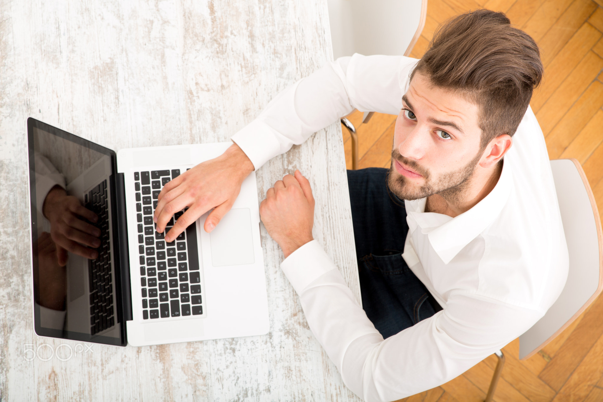 Young man with a laptop computer