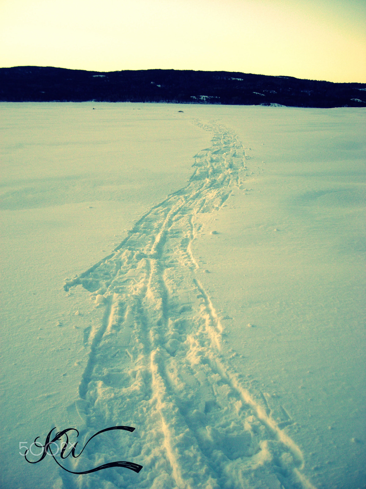 Nikon COOLPIX L2 sample photo. Snow shoe hike on the lake photography