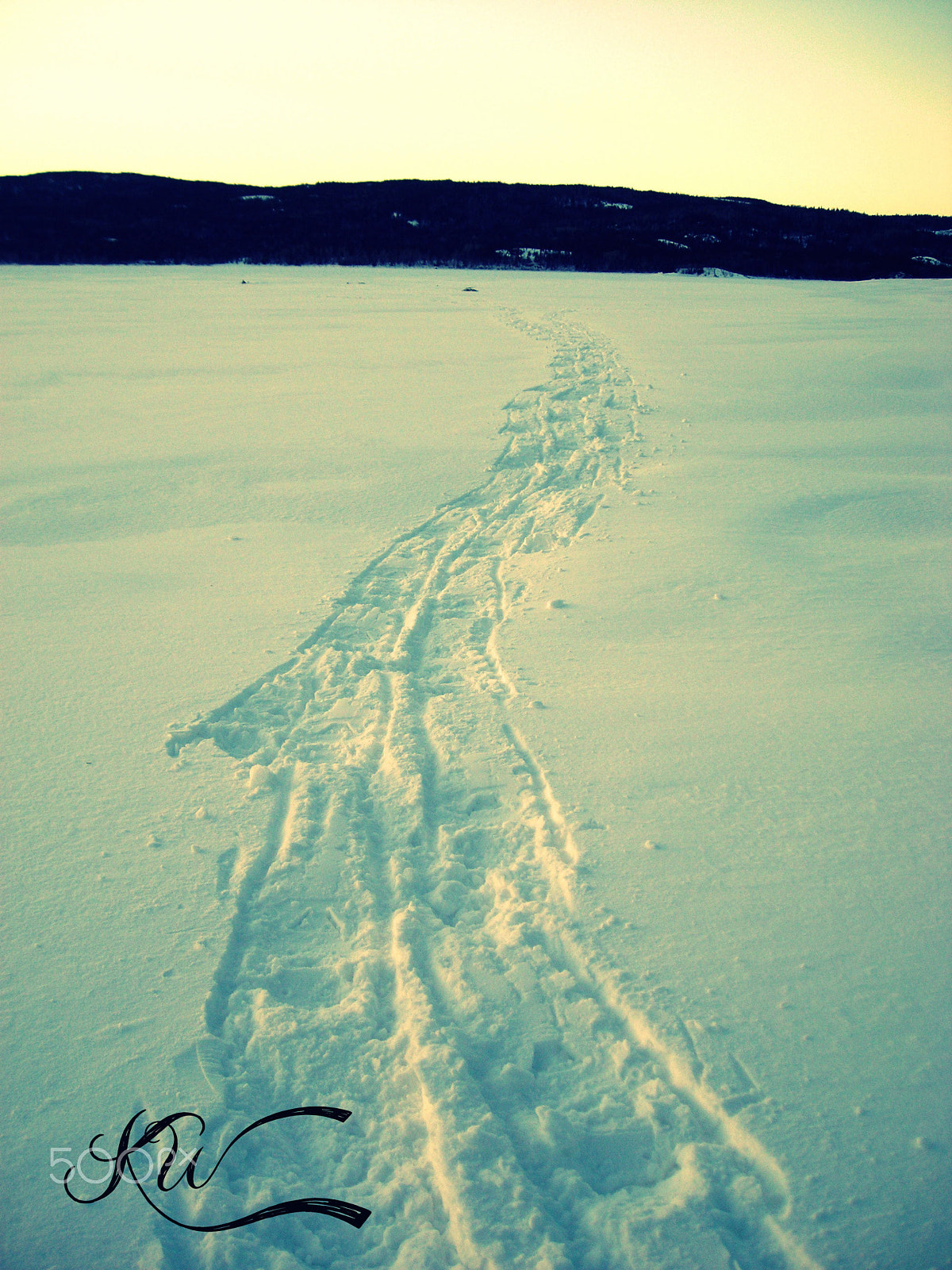 Nikon COOLPIX L2 sample photo. Snow shoe hike on the lake photography