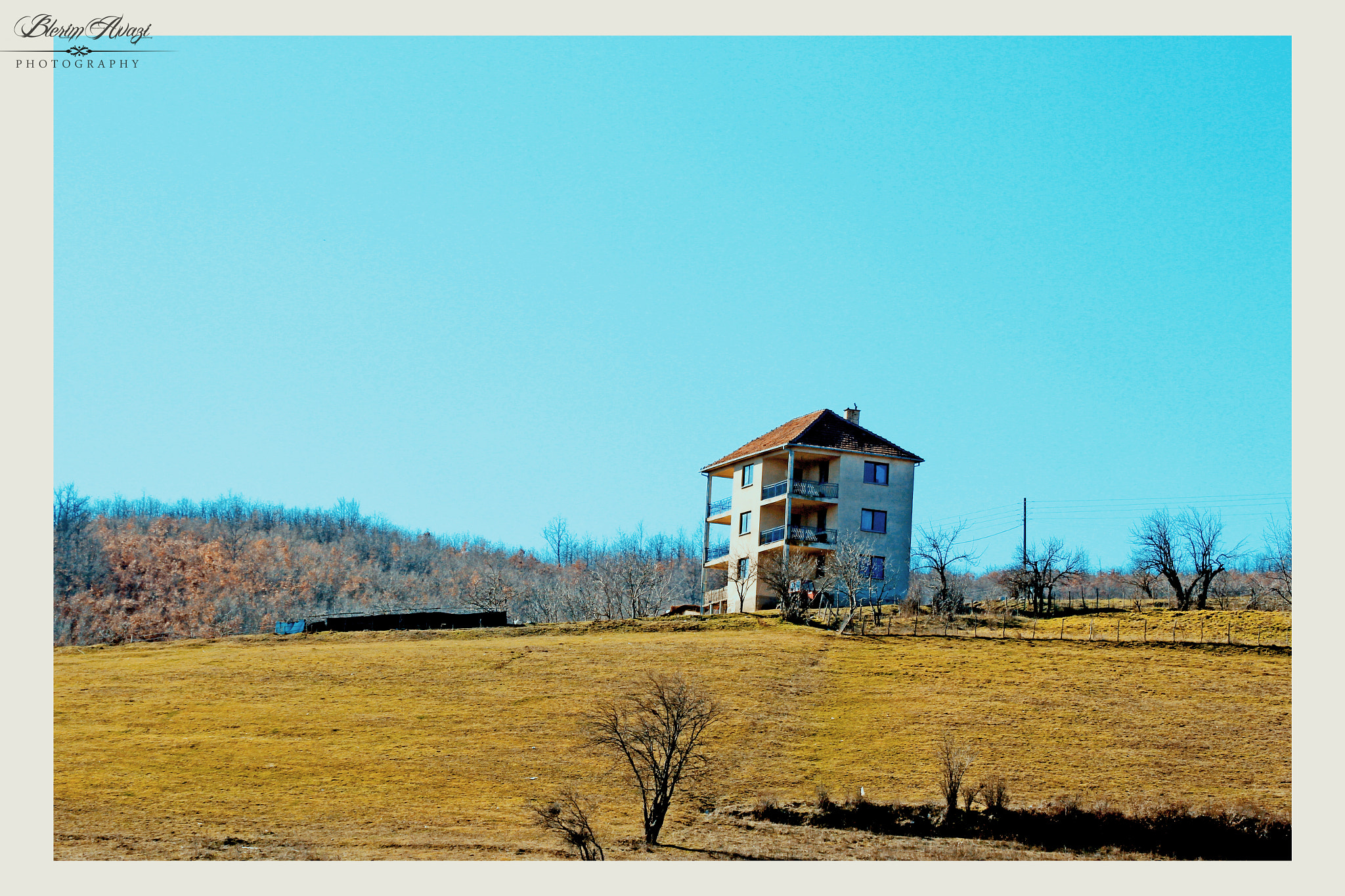 Canon EF 80-200mm F4.5-5.6 II sample photo. A house on the hill photography