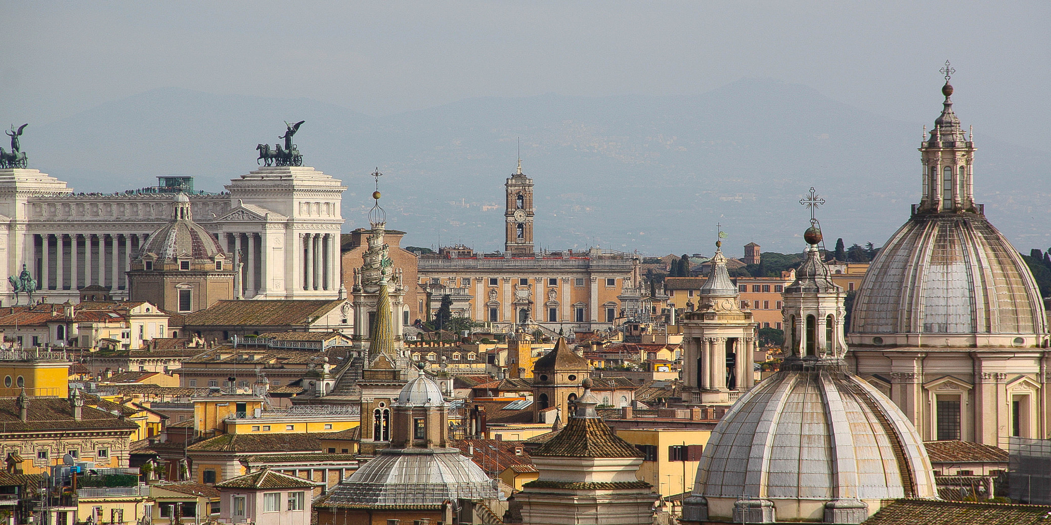 Canon EOS 450D (EOS Rebel XSi / EOS Kiss X2) + Canon EF-S 18-135mm F3.5-5.6 IS sample photo. Rooftops of rome photography