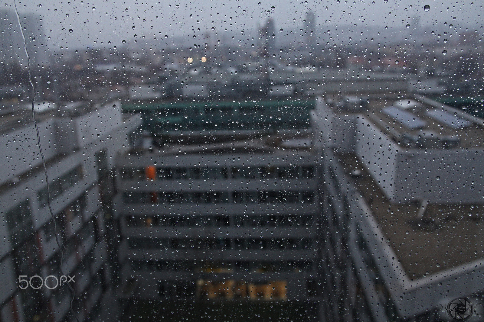 Canon EOS 50D + Canon EF 500mm F4L IS USM sample photo. Rain at business center photography