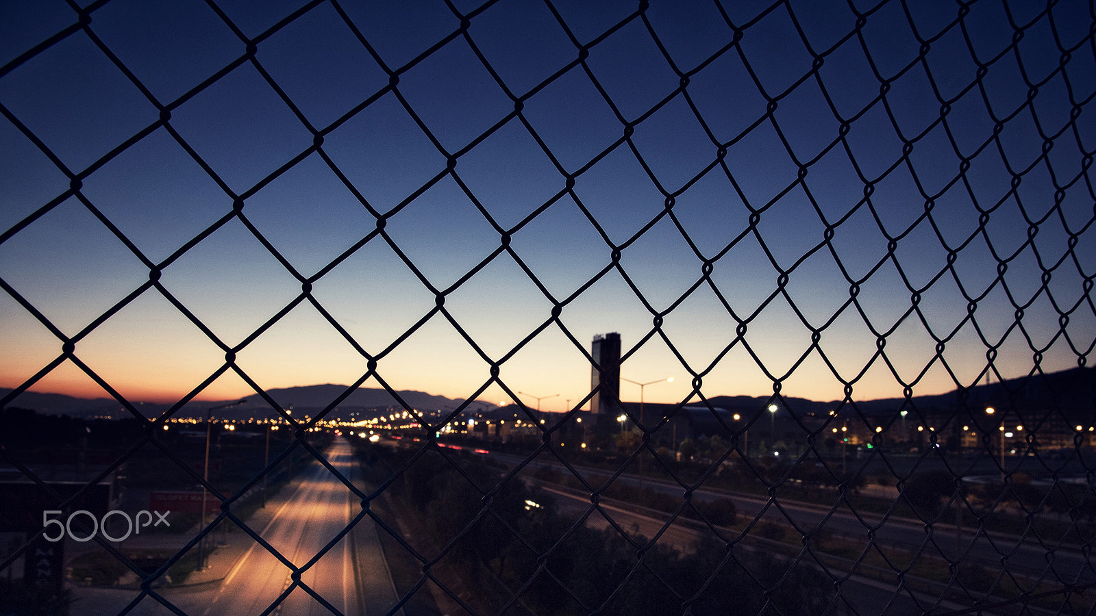 Canon EOS M2 sample photo. Fence of city photography