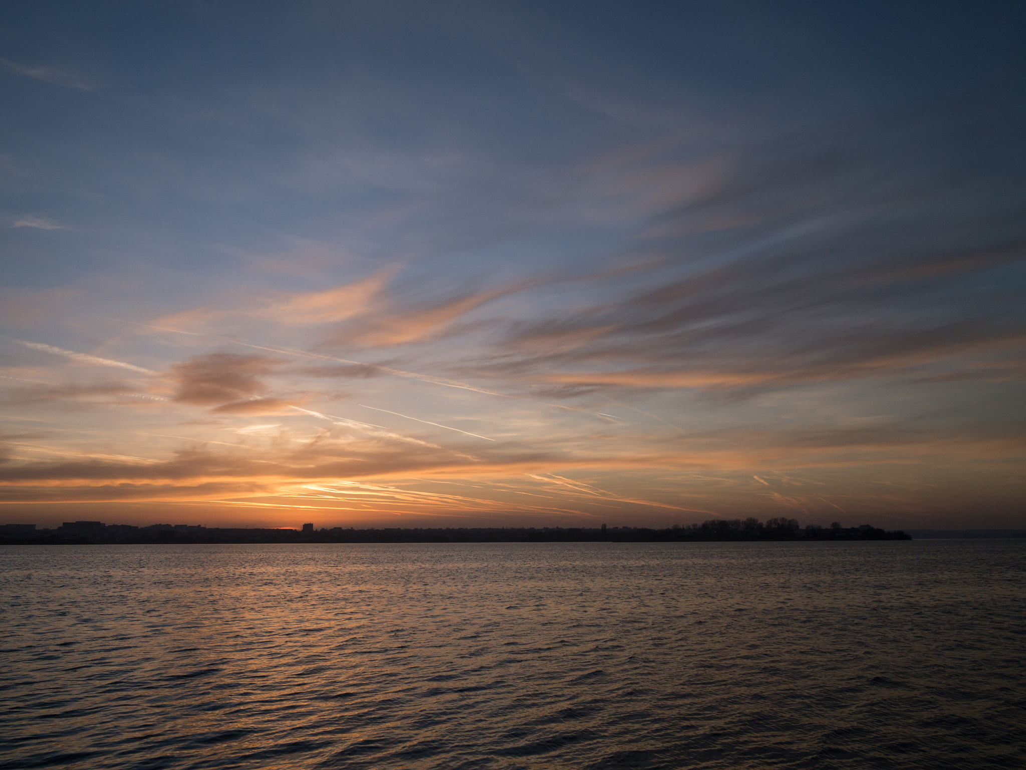 Olympus PEN E-PL3 + LEICA DG SUMMILUX 15/F1.7 sample photo. Colorful sunset behind a small city's skyline photography