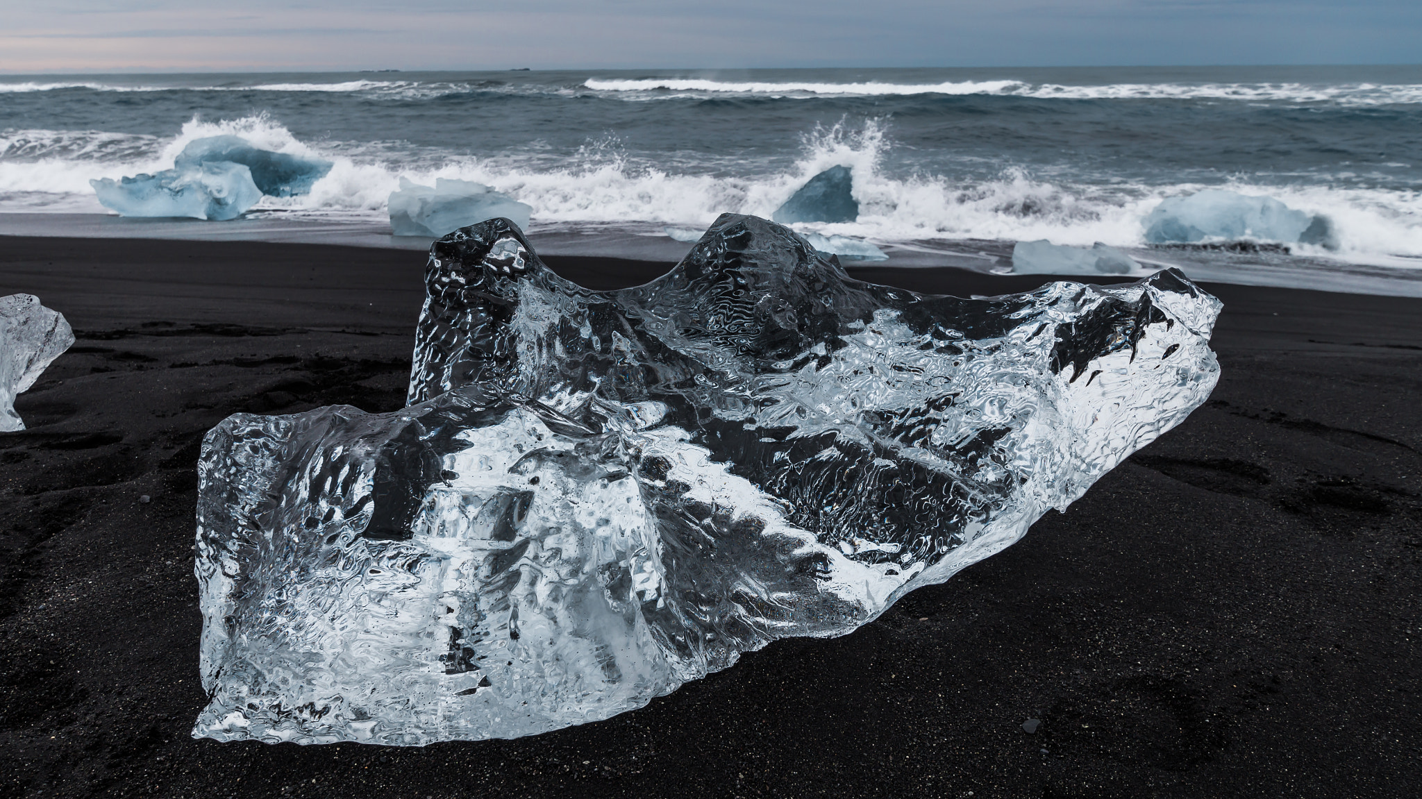 10-20mm F3.5 sample photo. Pure ice on black sand photography