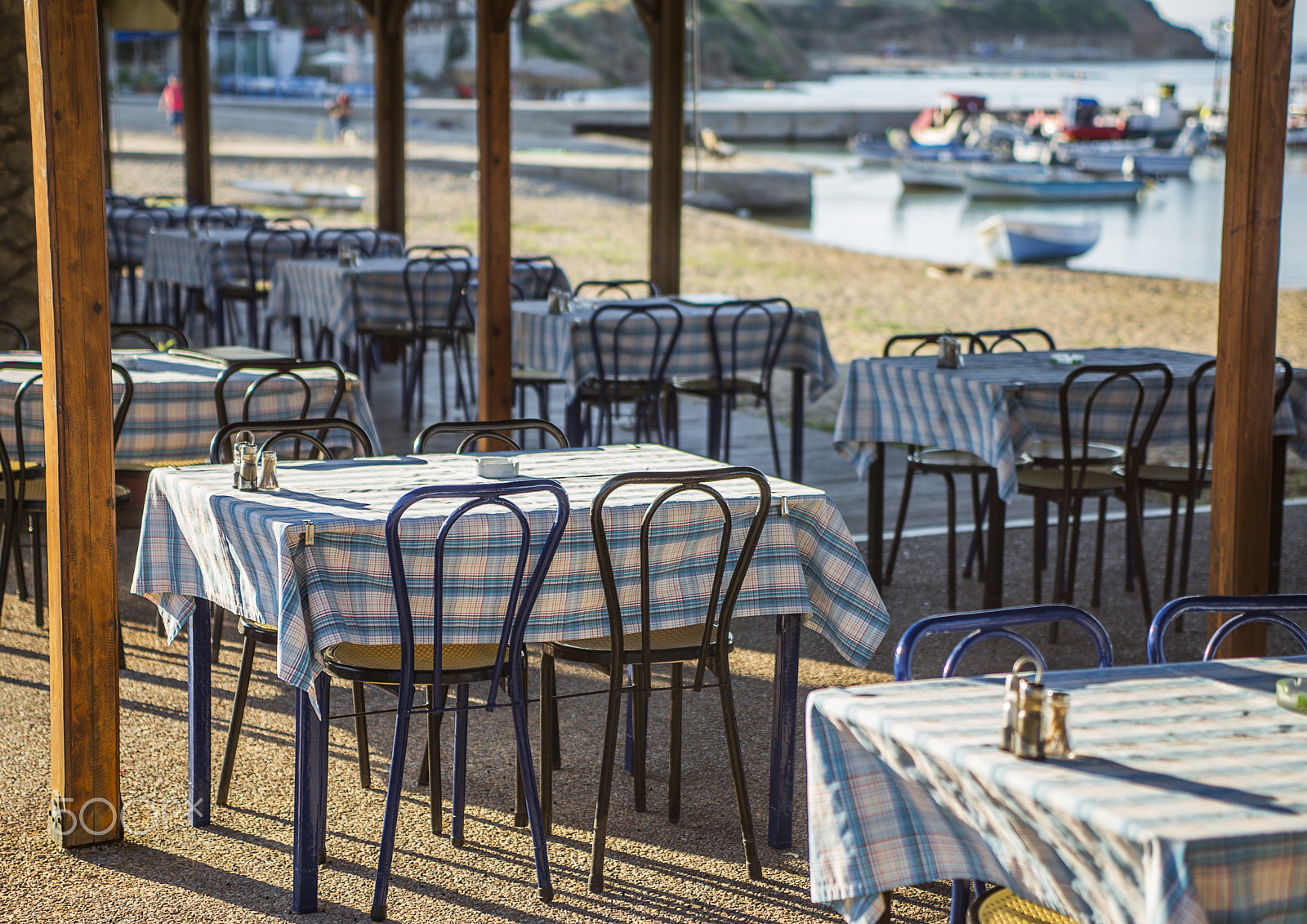 Nikon D610 + Sigma 24-70mm F2.8 EX DG Macro sample photo. Greek tavern with blue chairs, greece photography