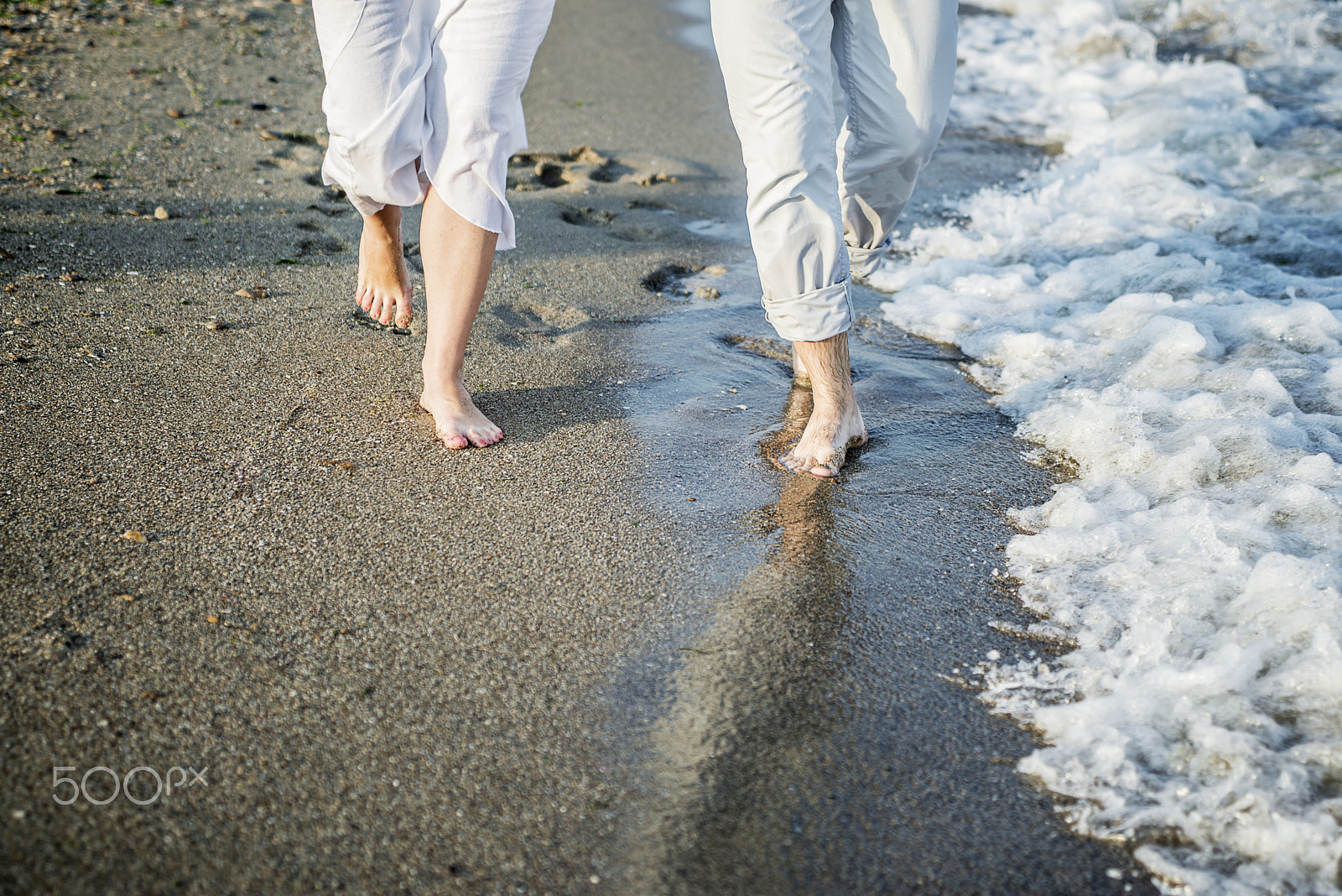 Sigma 24-70mm F2.8 EX DG Macro sample photo. Legs of couple on the sand beach photography