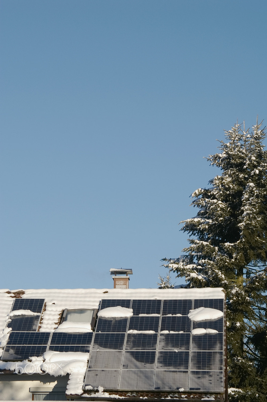 Pentax K100D Super + Pentax smc DA 50-200mm F4-5.6 ED sample photo. Solarcells on roof covered with snow photography