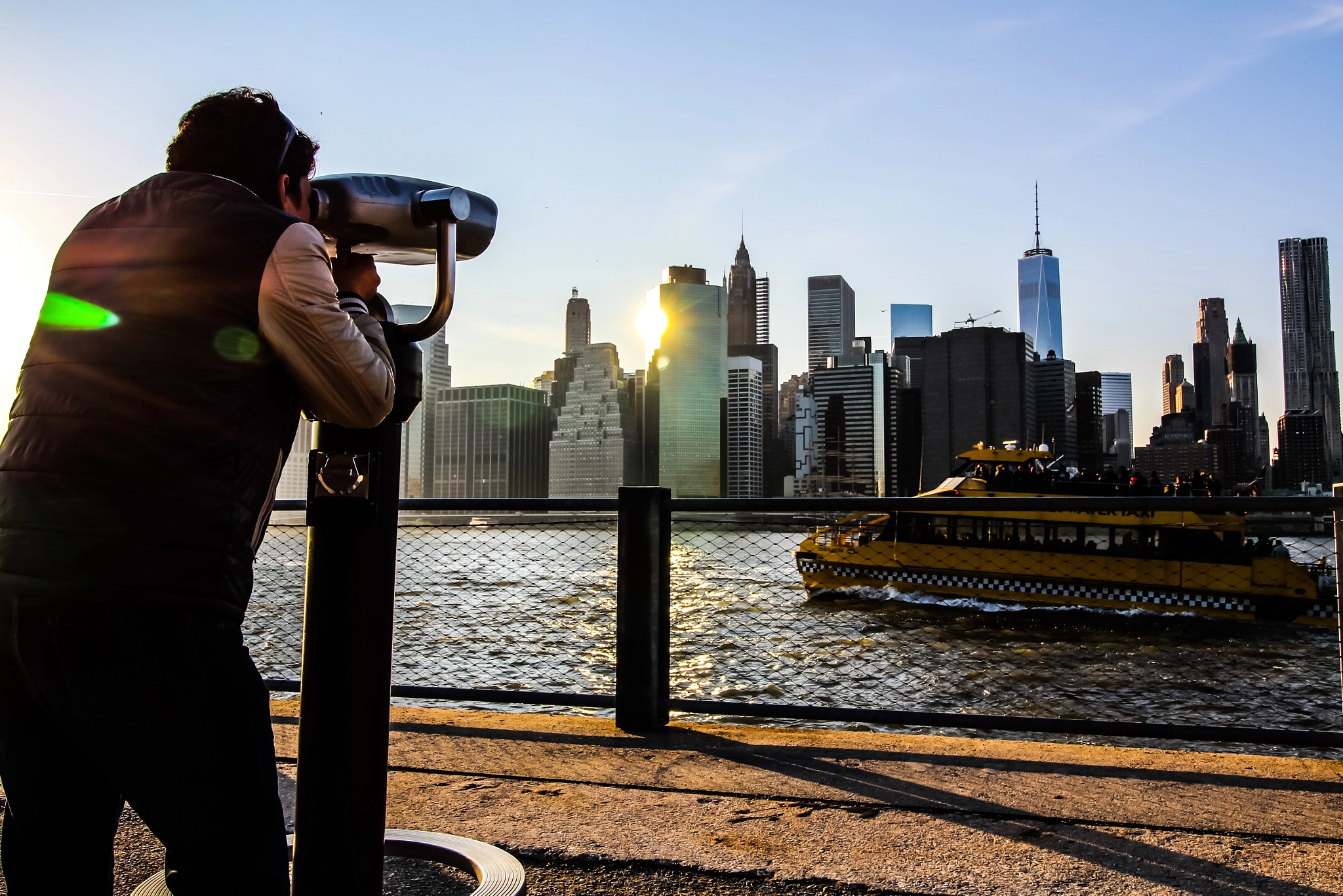 Canon EF-S 10-18mm F4.5–5.6 IS STM sample photo. Young man taking in the beautiful view through the telescope photography