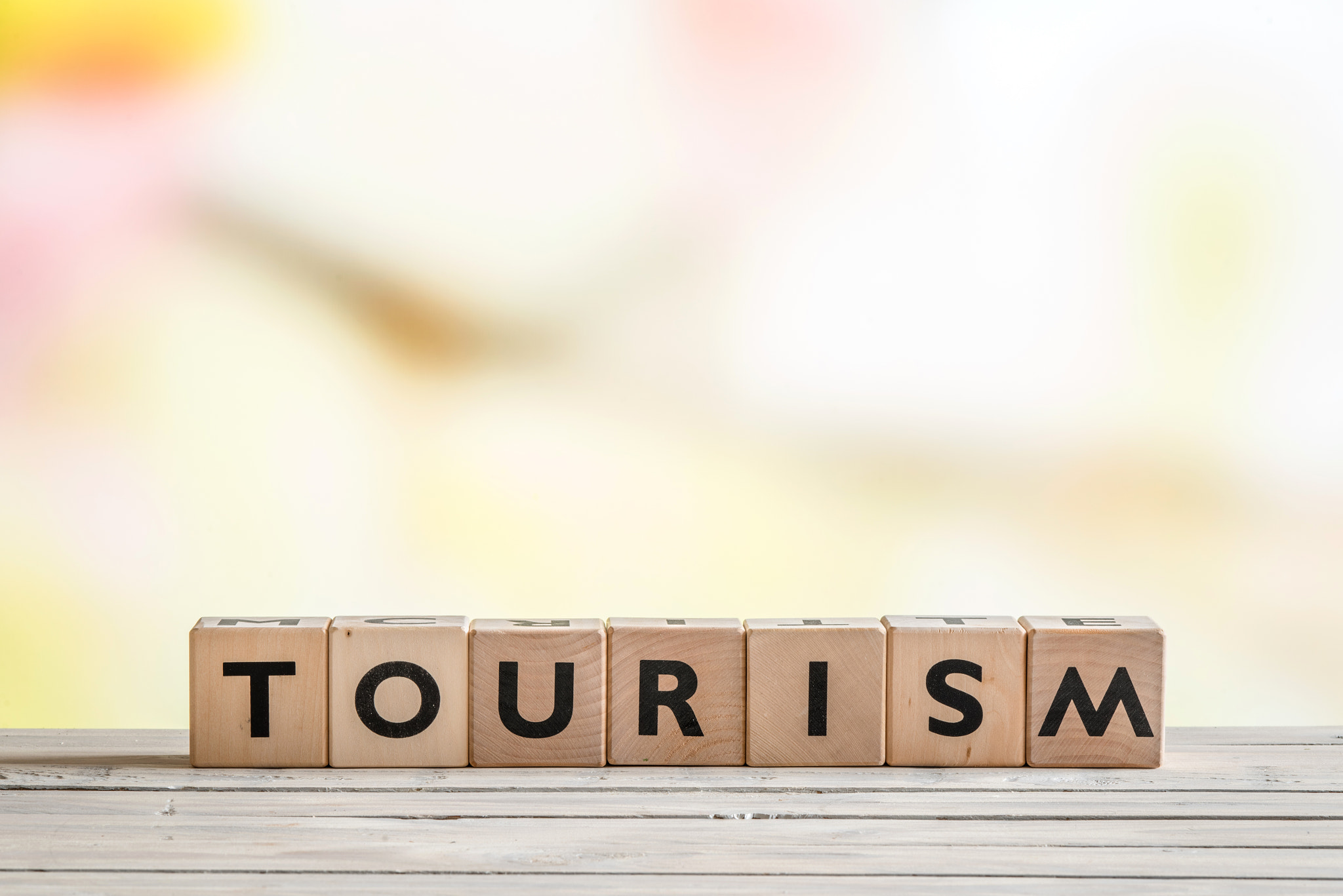 Tourism sign on a wooden desk