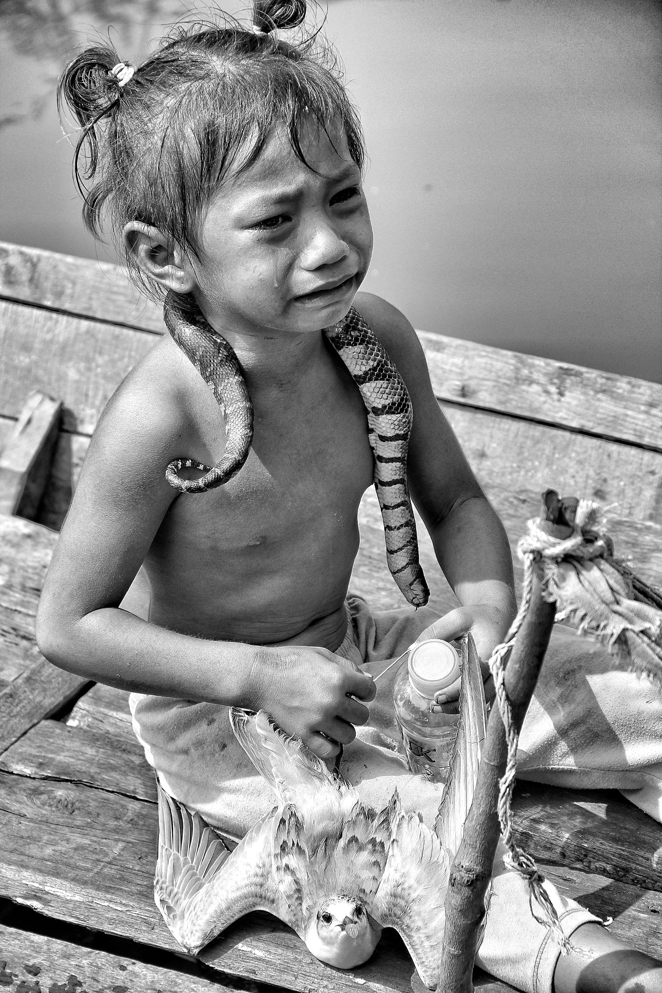 Canon EF-S 18-135mm F3.5-5.6 IS sample photo. Snake charmer child photography