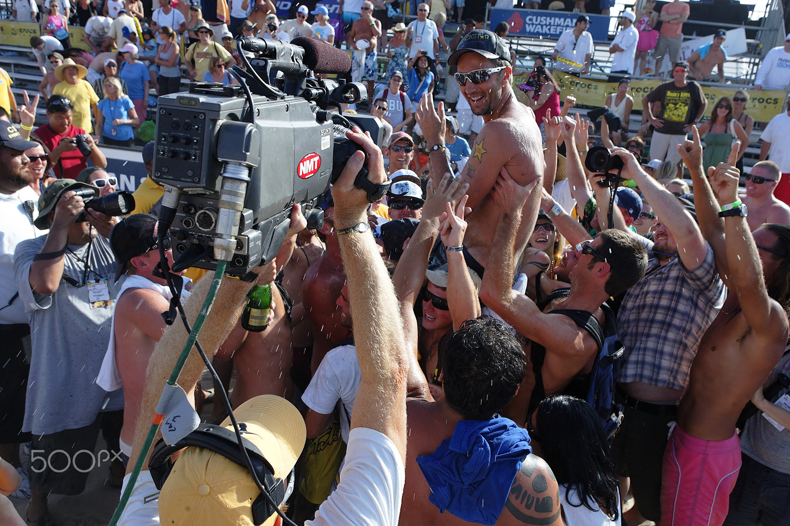 Canon EOS-1D Mark II sample photo. Sean rosenthal is held aloft by "rosie's raiders" after winning the title at his hometown beach... photography