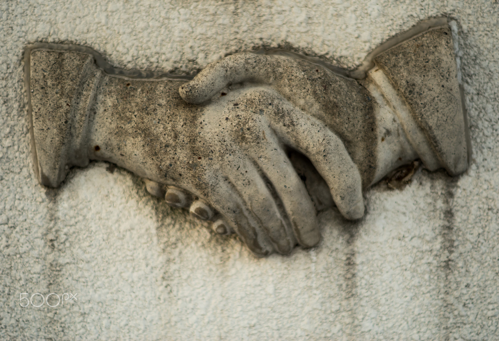 Nikon D5500 + Nikon AF-S Nikkor 50mm F1.4G sample photo. Handshake in stone relief photography