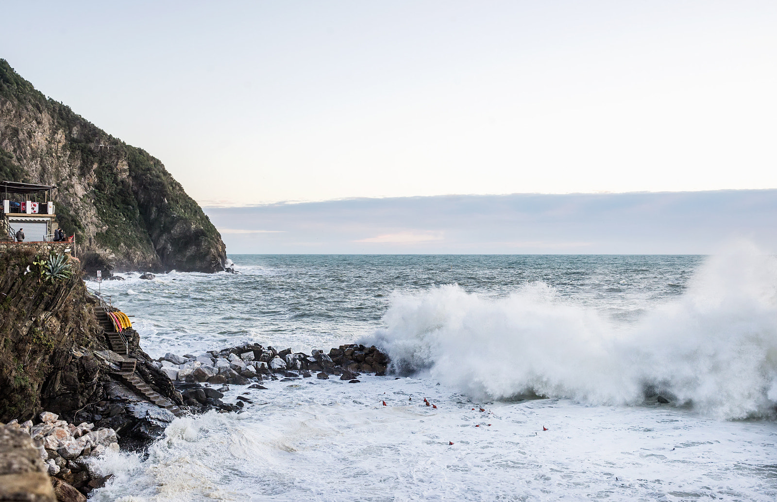 Nikon D610 + ZEISS Distagon T* 35mm F2 sample photo. Riomaggiore, italy - 10, february. big waves during stormy day at riomaggiore fishermen's village... photography