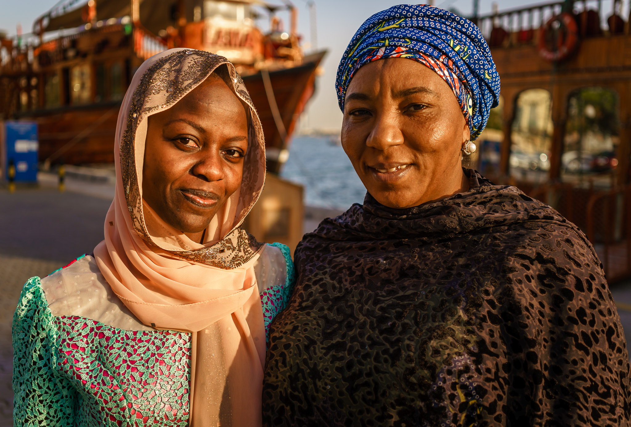Sigma 30mm F2.8 EX DN sample photo. Nigerian ladies strolling dubai creek photography