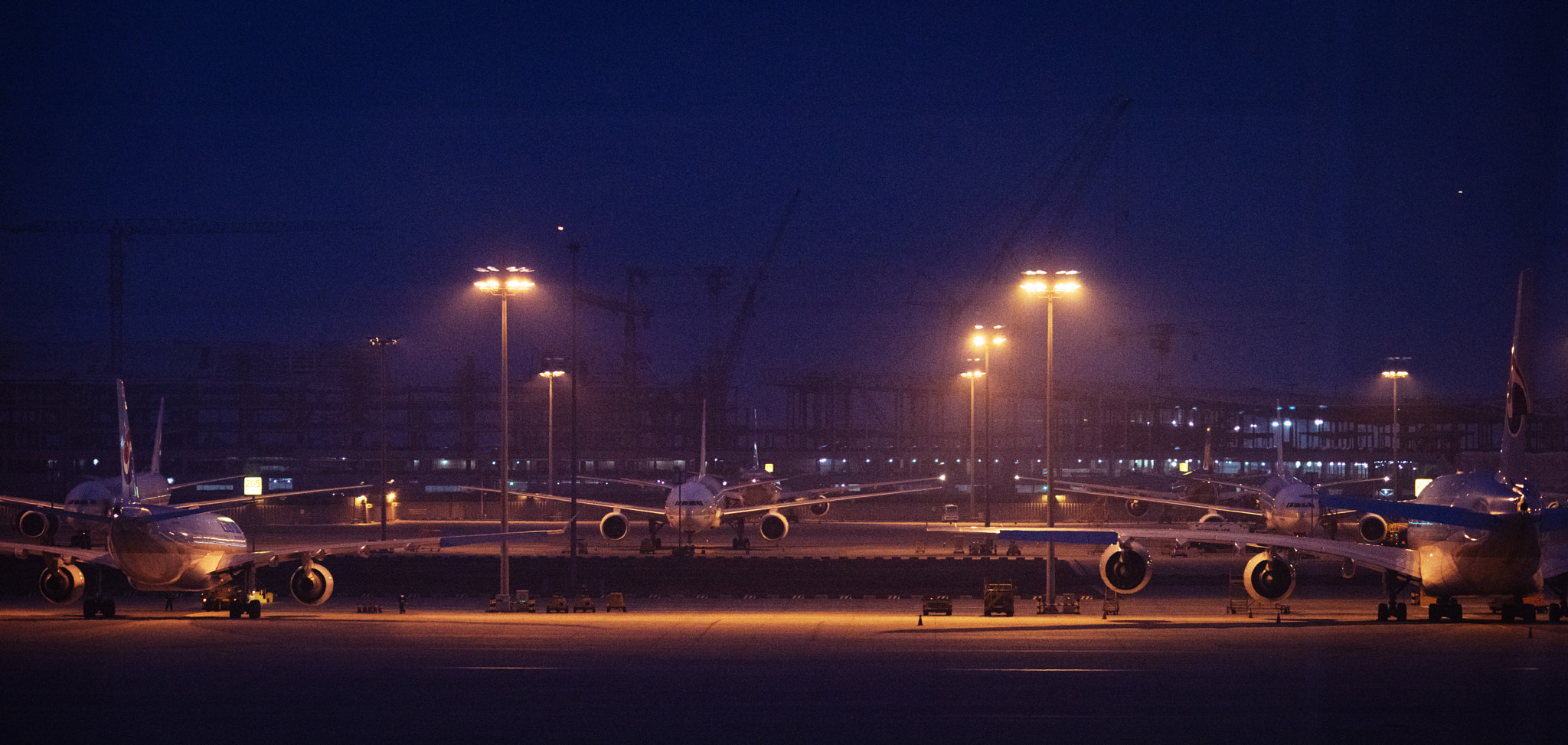 AF DC-Nikkor 135mm f/2 sample photo. Airliners parked in apron photography