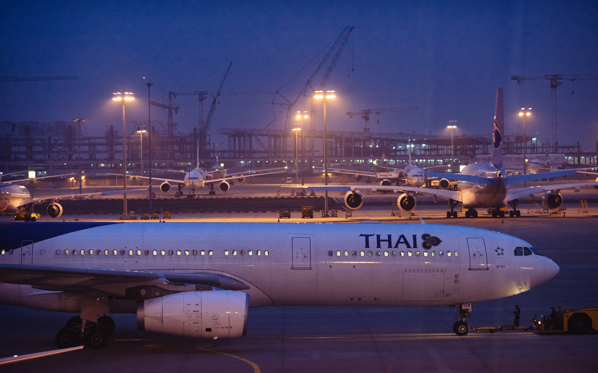 Nikon D810 + AF DC-Nikkor 135mm f/2 sample photo. Airbus a330 towed in the parking ramp photography
