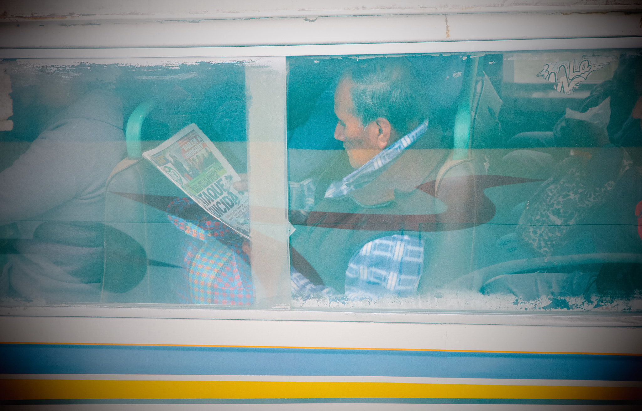Canon EF-S 15-85mm F3.5-5.6 IS USM sample photo. Suicide attack! a peruvian man reading the news ab ... photography