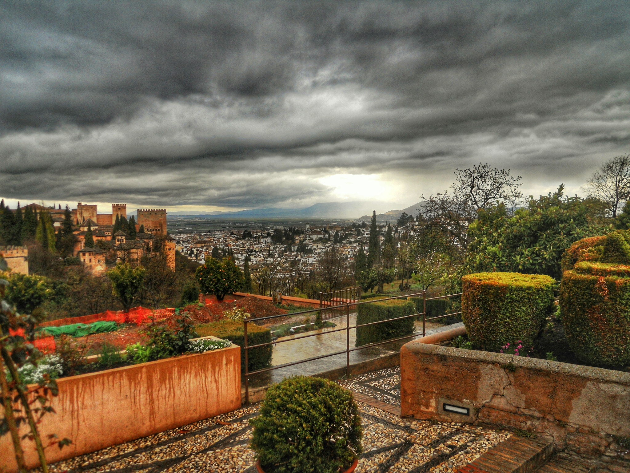 Nikon Coolpix S570 sample photo. Dark clouds and alhambra photography