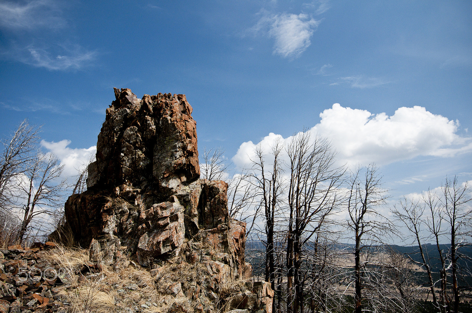 Nikon AF-S Nikkor 16-35mm F4G ED VR sample photo. Panoramic views of lone rock amongst white clouds photography