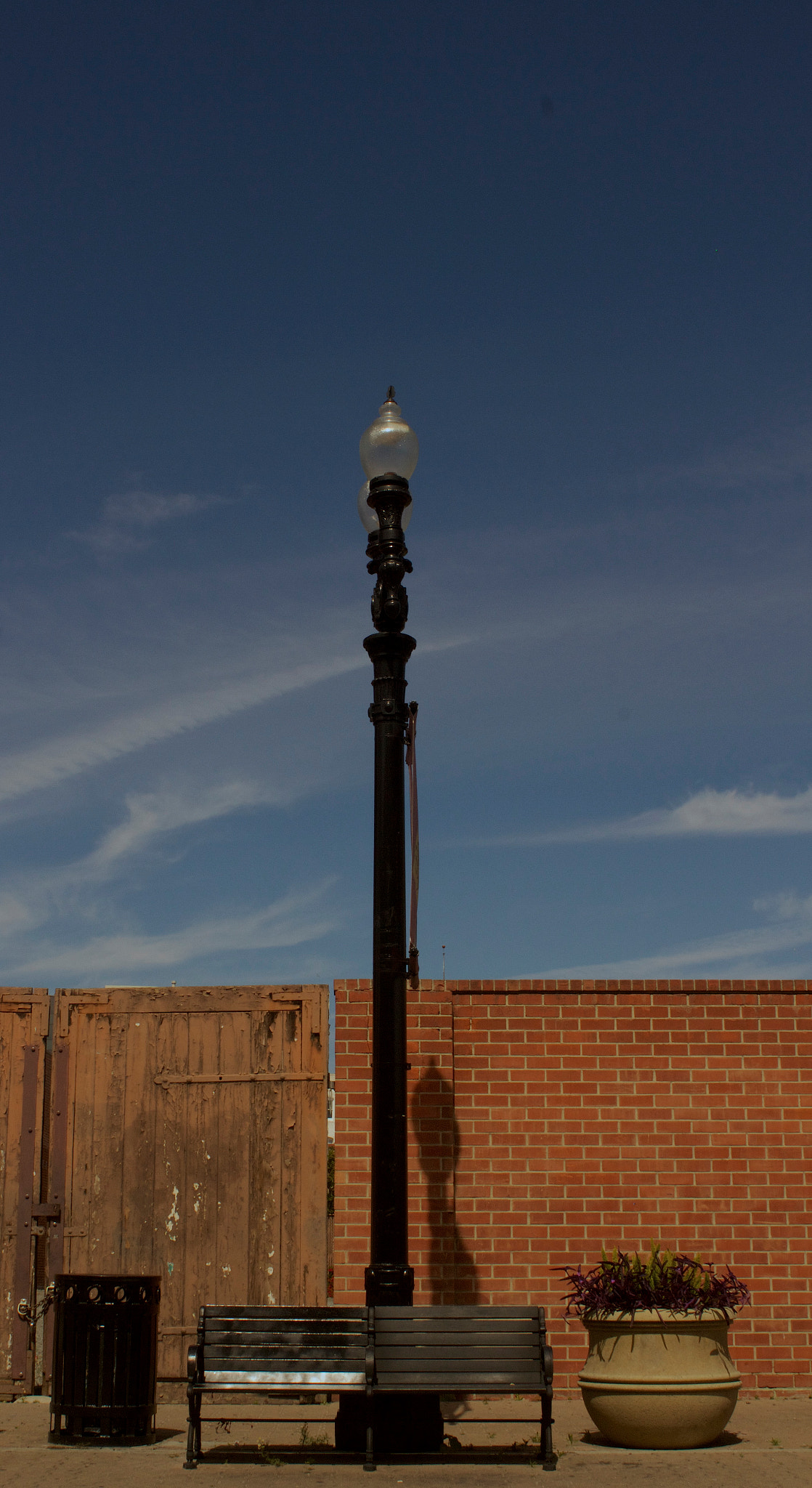 Canon EOS 600D (Rebel EOS T3i / EOS Kiss X5) + Canon EF 28mm F2.8 sample photo. Bench and lamp downtown santa ana photography