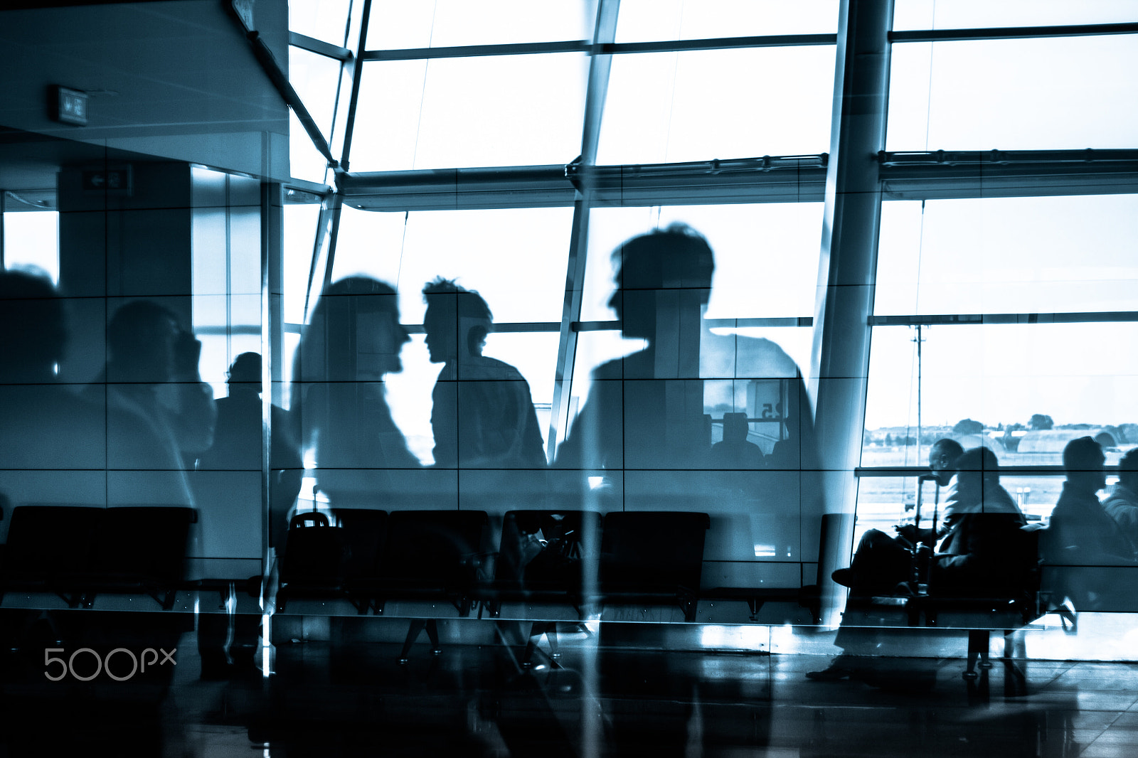 Canon EOS 7D + Canon EF 50mm f/1.8 sample photo. People traveling on airport silhouettes photography