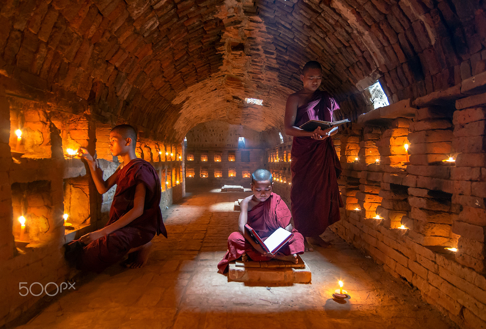 Pentax K-5 IIs sample photo. Three young monk in the cave with candle light photography