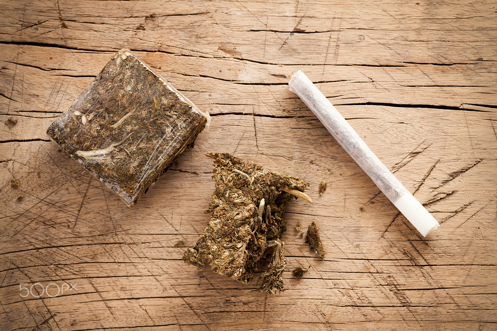 ZEISS Makro-Planar T* 100mm F2 sample photo. Weed marijuana hashish roll wood background photography