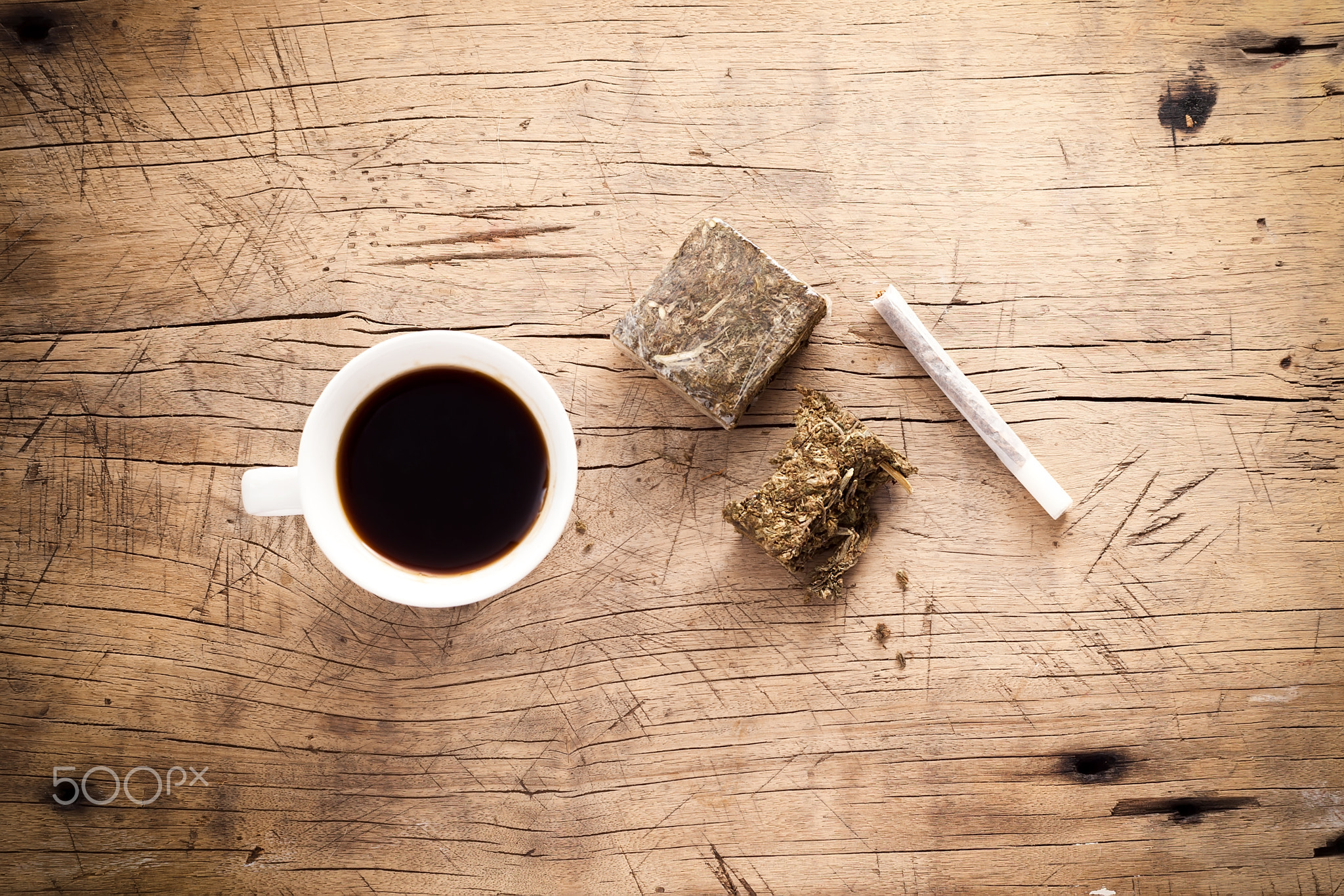 weed marijuana hashish roll wood background