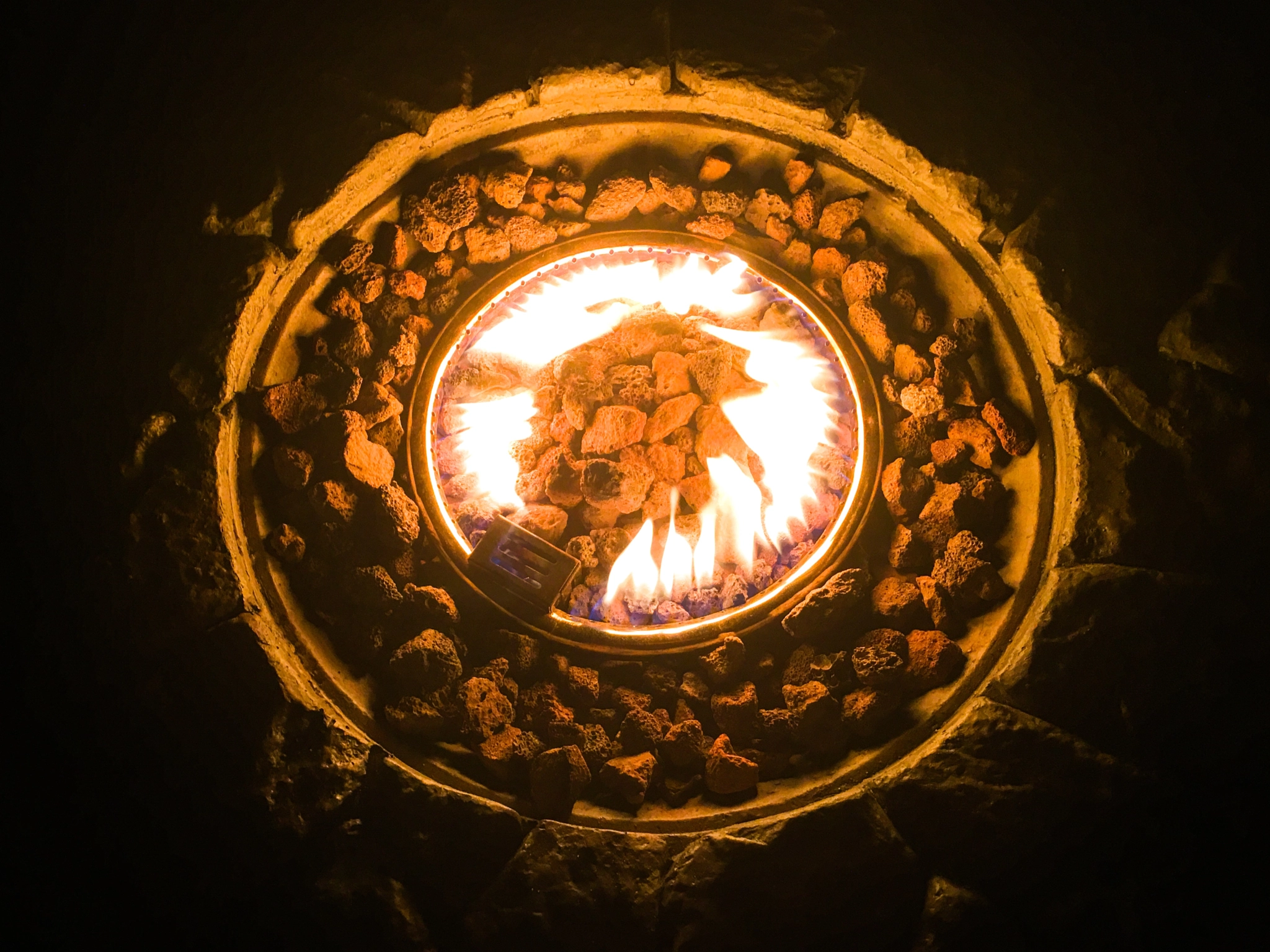 Apple iPhone sample photo. Fire pit at night photography