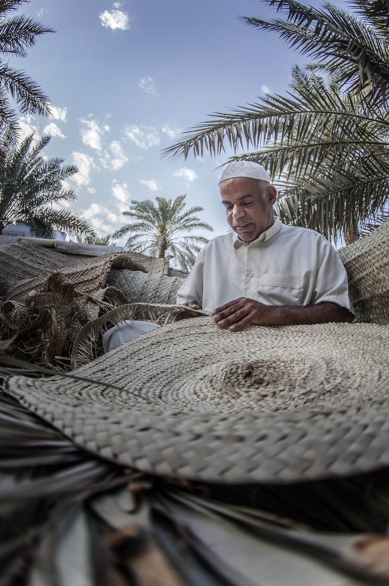Canon EOS 5D Mark II + Tokina AT-X 10-17mm F3.5-4.5 DX Fisheye sample photo. Daily basis this man spend his time in working to make this shape with peace of palm. photography
