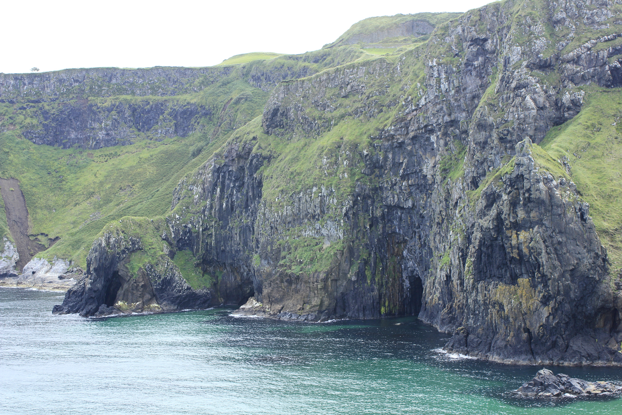 Canon EF-S 18-55mm F3.5-5.6 IS sample photo. Caves in the cliffs photography