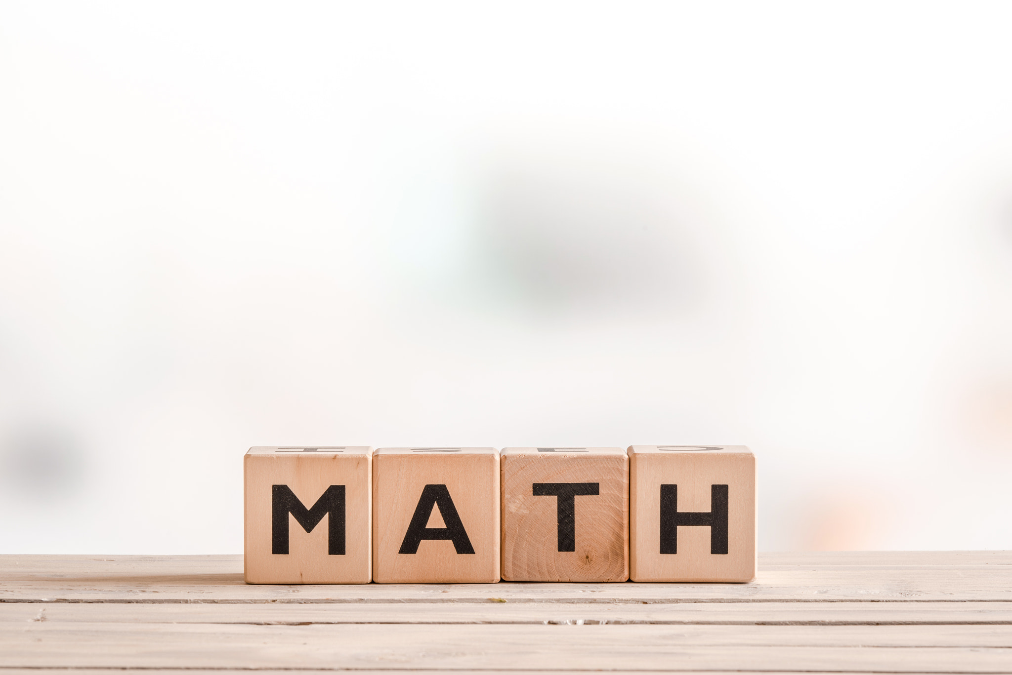 Math lesson sign on a wooden table