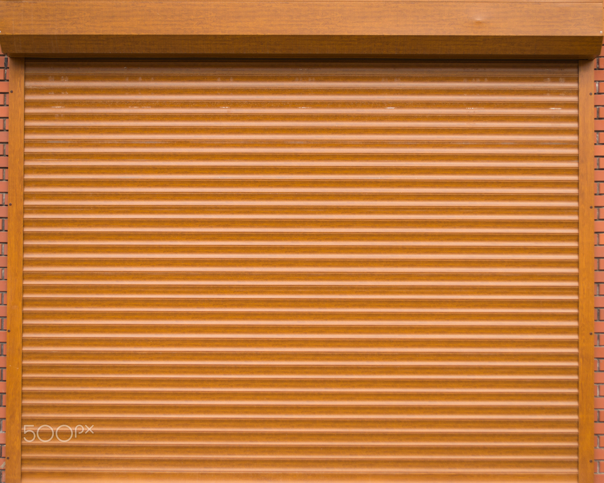 Orange roll gates with bricks on the sides