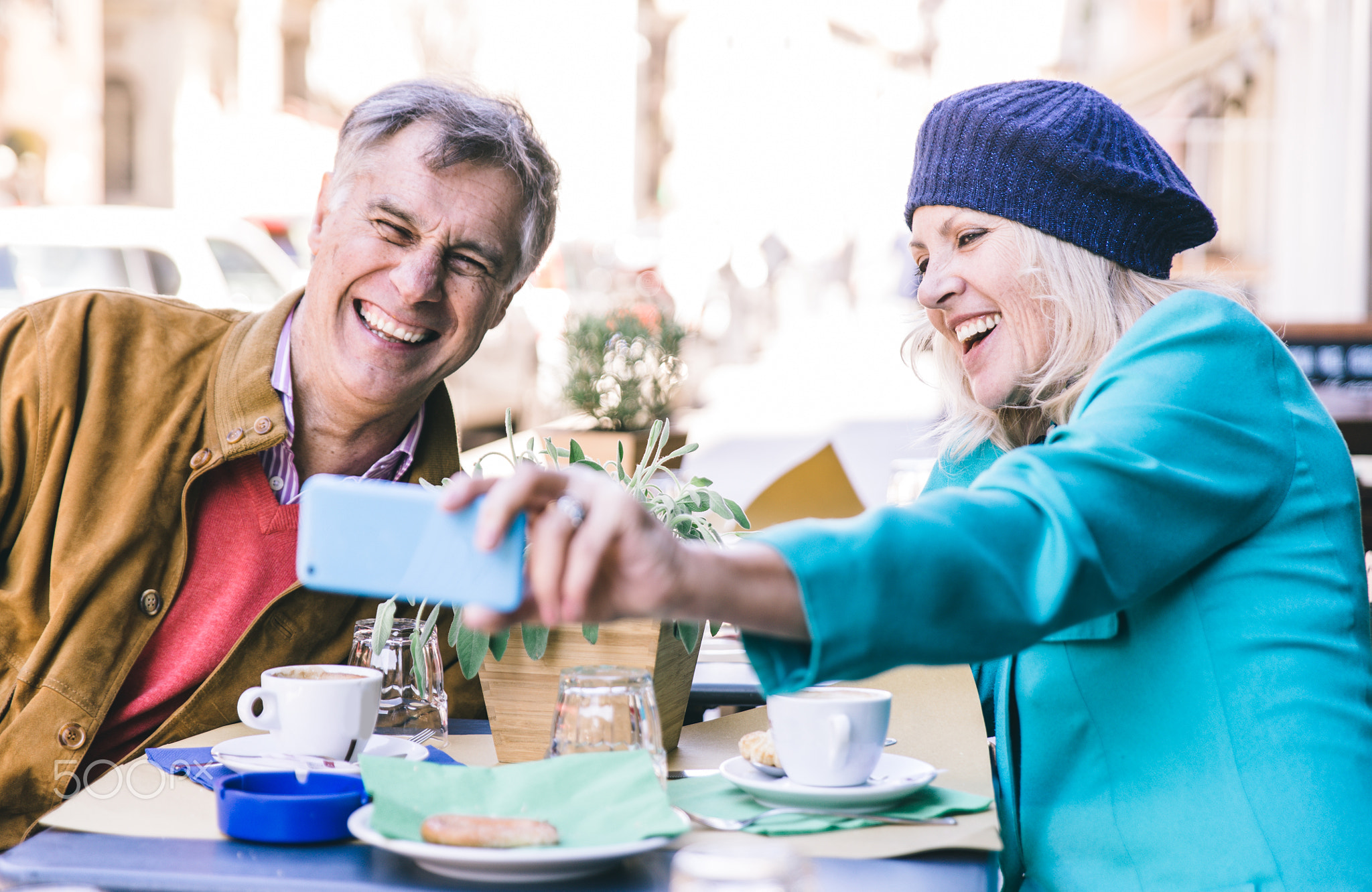 Senior couple having a coffee in a bar