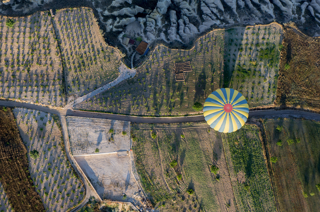 top view of the air balloon over fields, mountains and road, Cappadocia, Turkey by Polonsky Dmitry on 500px.com