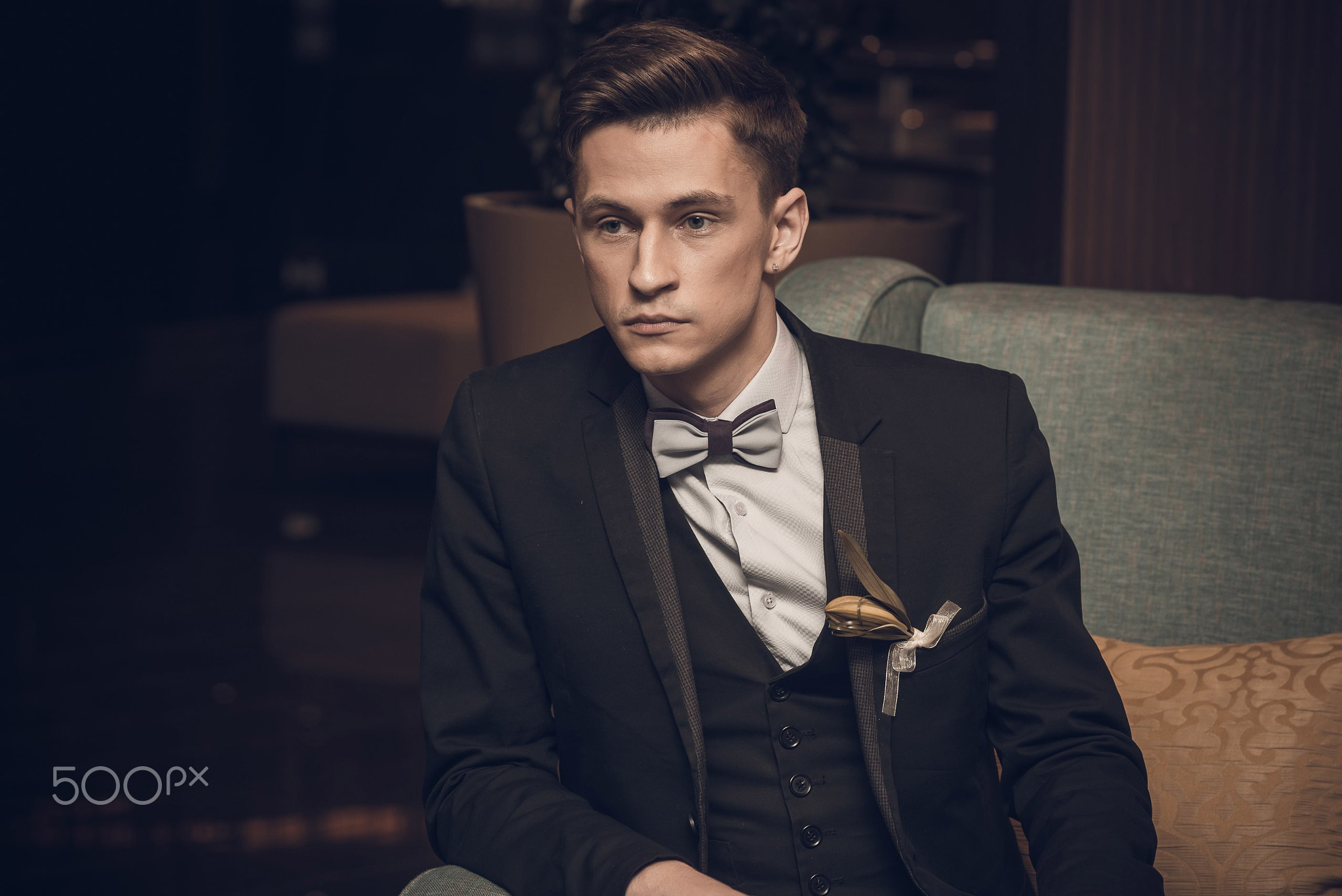 Confident businessman sitting in armchair