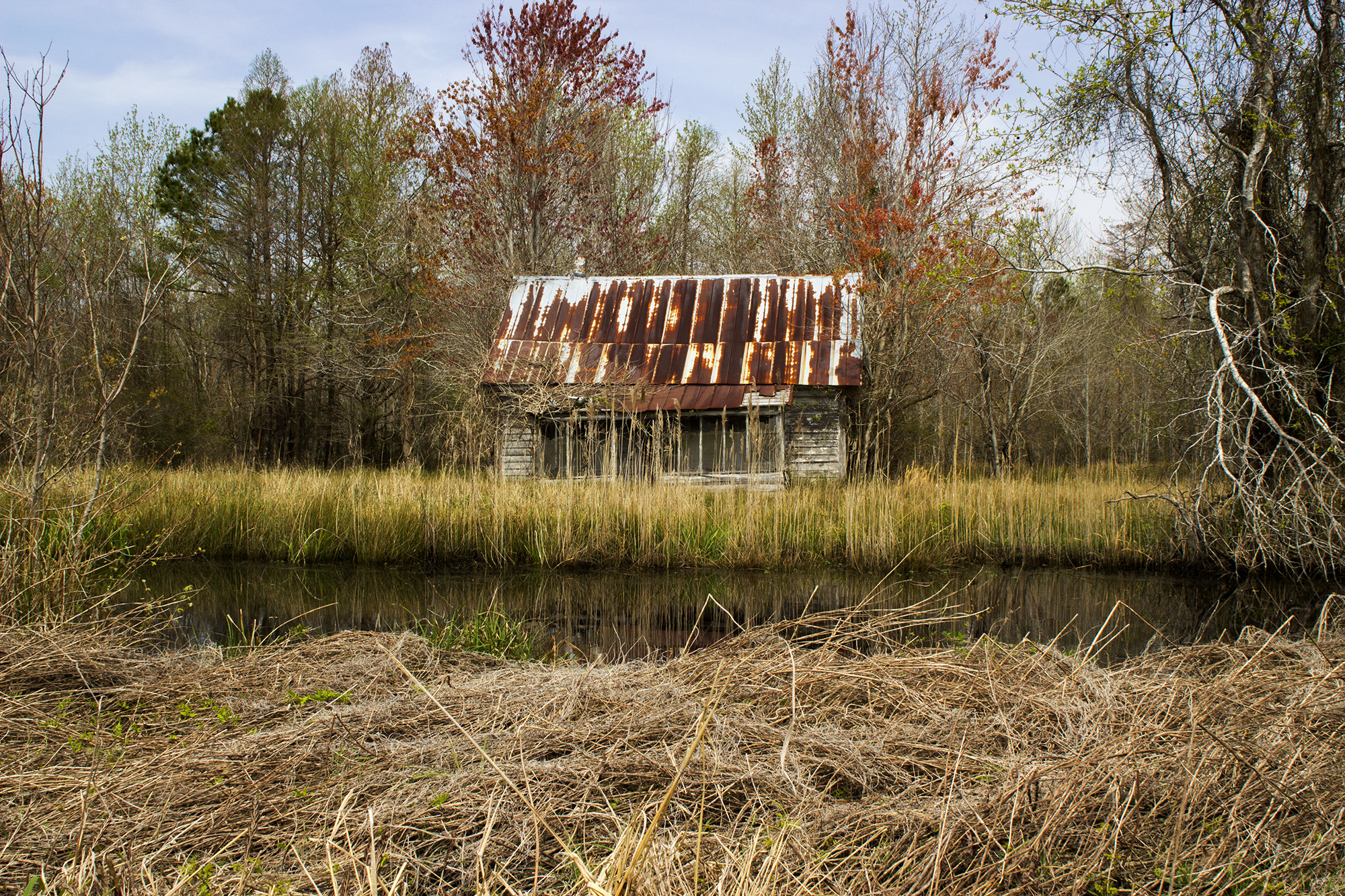 Canon EOS 600D (Rebel EOS T3i / EOS Kiss X5) + Canon EF 24mm F2.8 sample photo. A house by the water photography