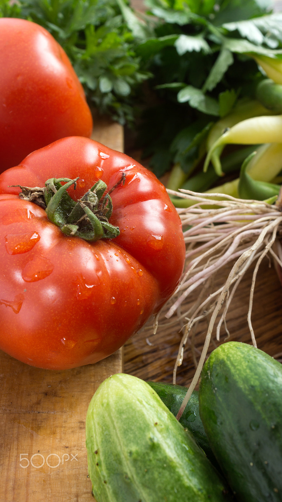 Minolta AF 28-85mm F3.5-4.5 sample photo. Several vegetables on wooden chopping board and table. photography