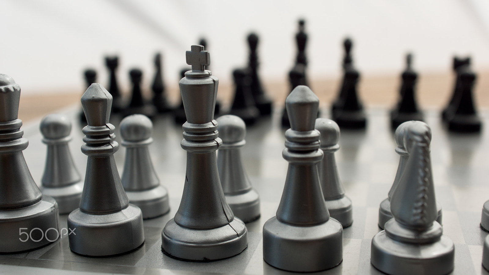 Sony SLT-A77 + Minolta AF 28-85mm F3.5-4.5 sample photo. Light and dark wooden chess pieces on chess table. photography