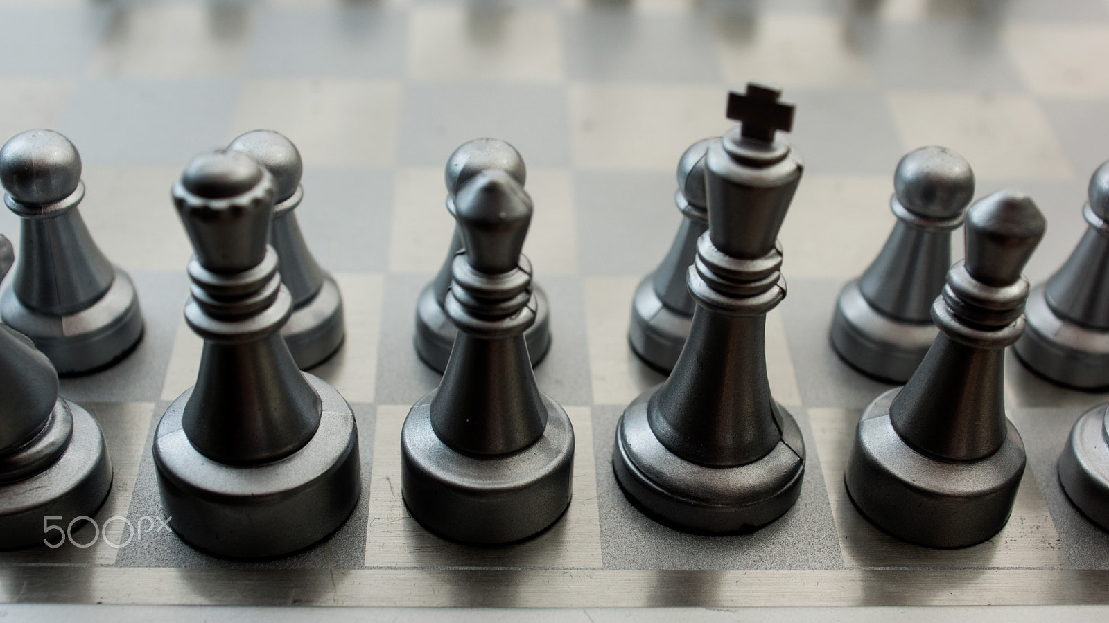 Sony SLT-A77 + Minolta AF 28-85mm F3.5-4.5 sample photo. Light and dark wooden chess pieces on chess table. photography